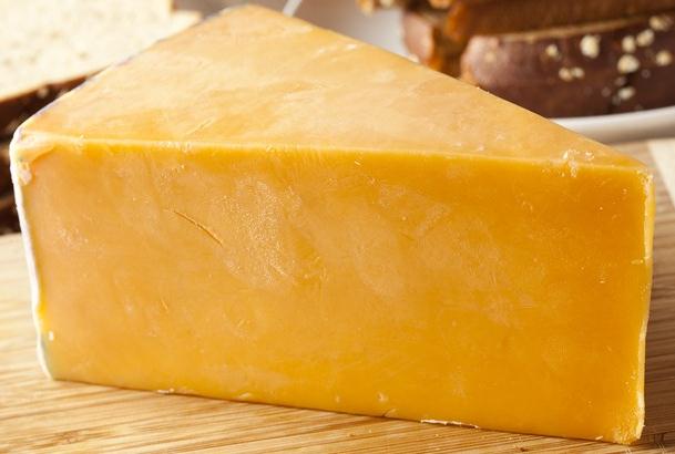a block of cheddar cheese