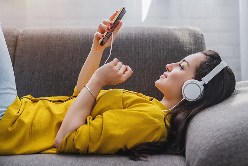 A photo of a woman listening to music