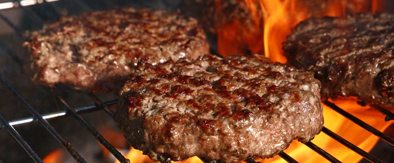 burger patties being grilled