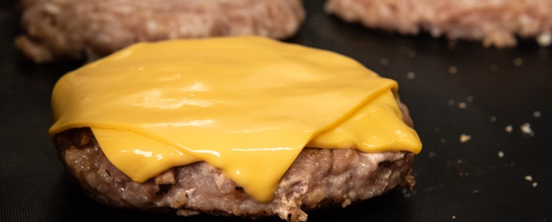 melted cheese on a patty