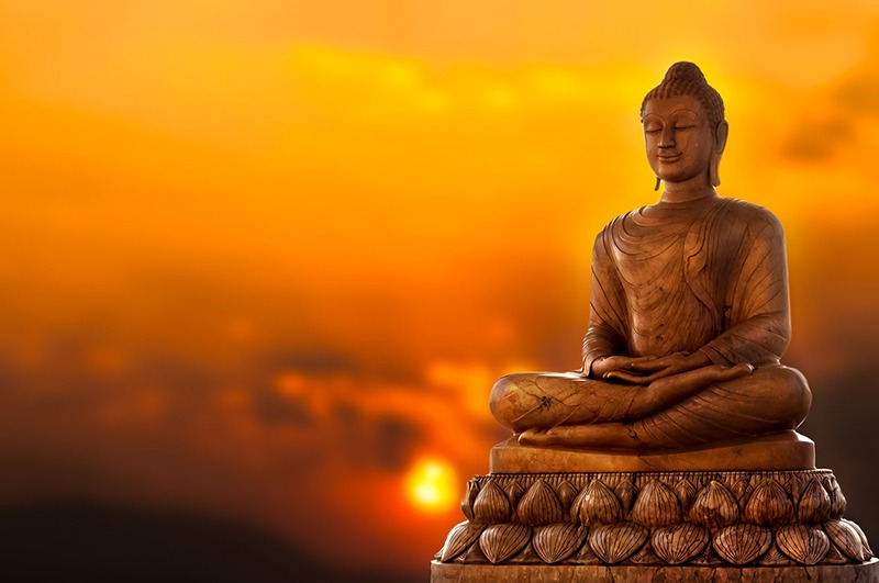 Buddha Statue and a sunset background