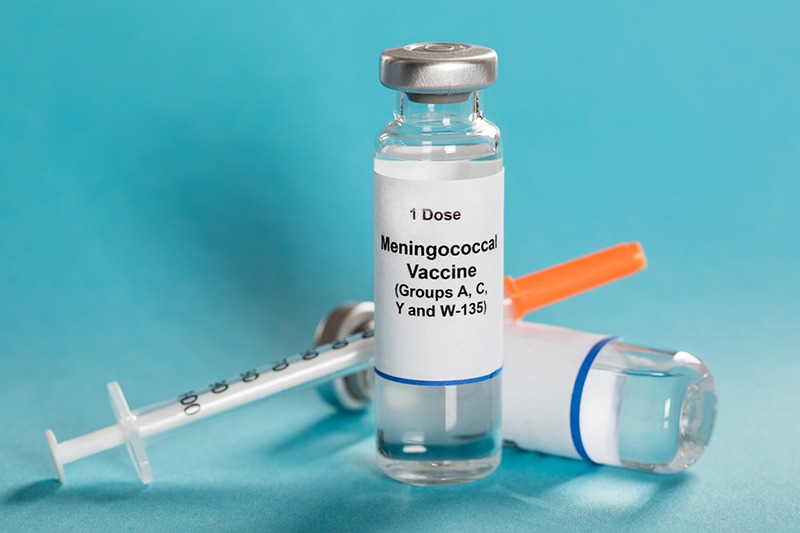 Picture of meningococcal vaccine with a syringe.