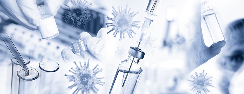 Picture of vaccine and syringe with virus graphics in the background.