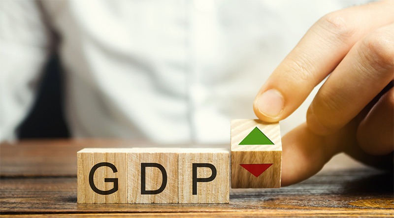 Wooden blocks with word GDP and up and down arrows
