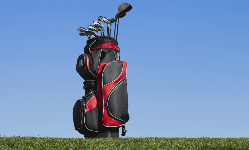 a golf bag containing golf clubs