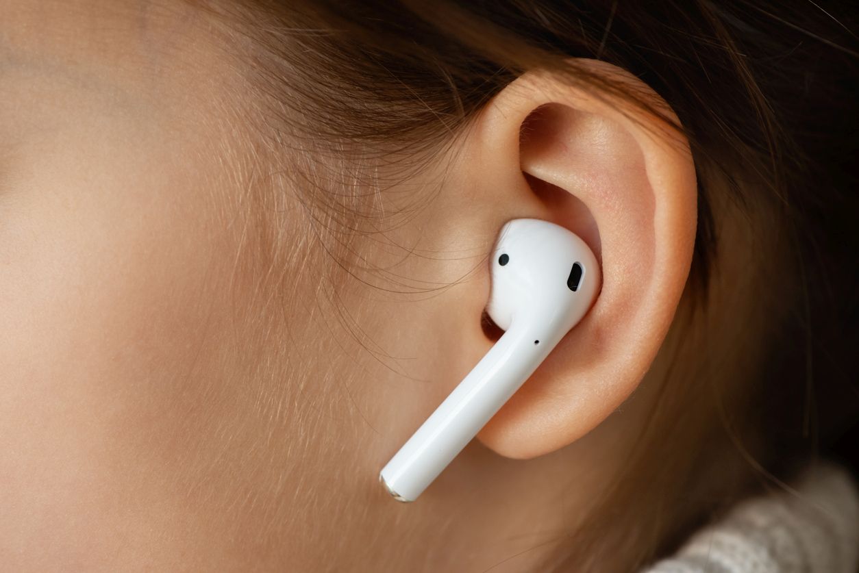 person wearing AirPods