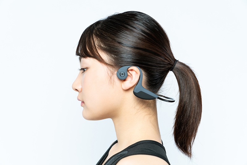 woman wearing bone conduction headphones
