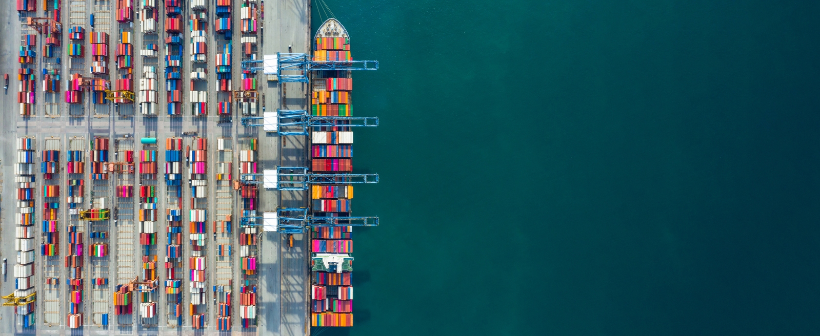 Aerial view container ship in port at container terminal port