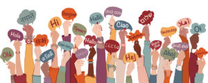 Many arms raised of diverse and multi-ethnic people holding speech bubbles with text