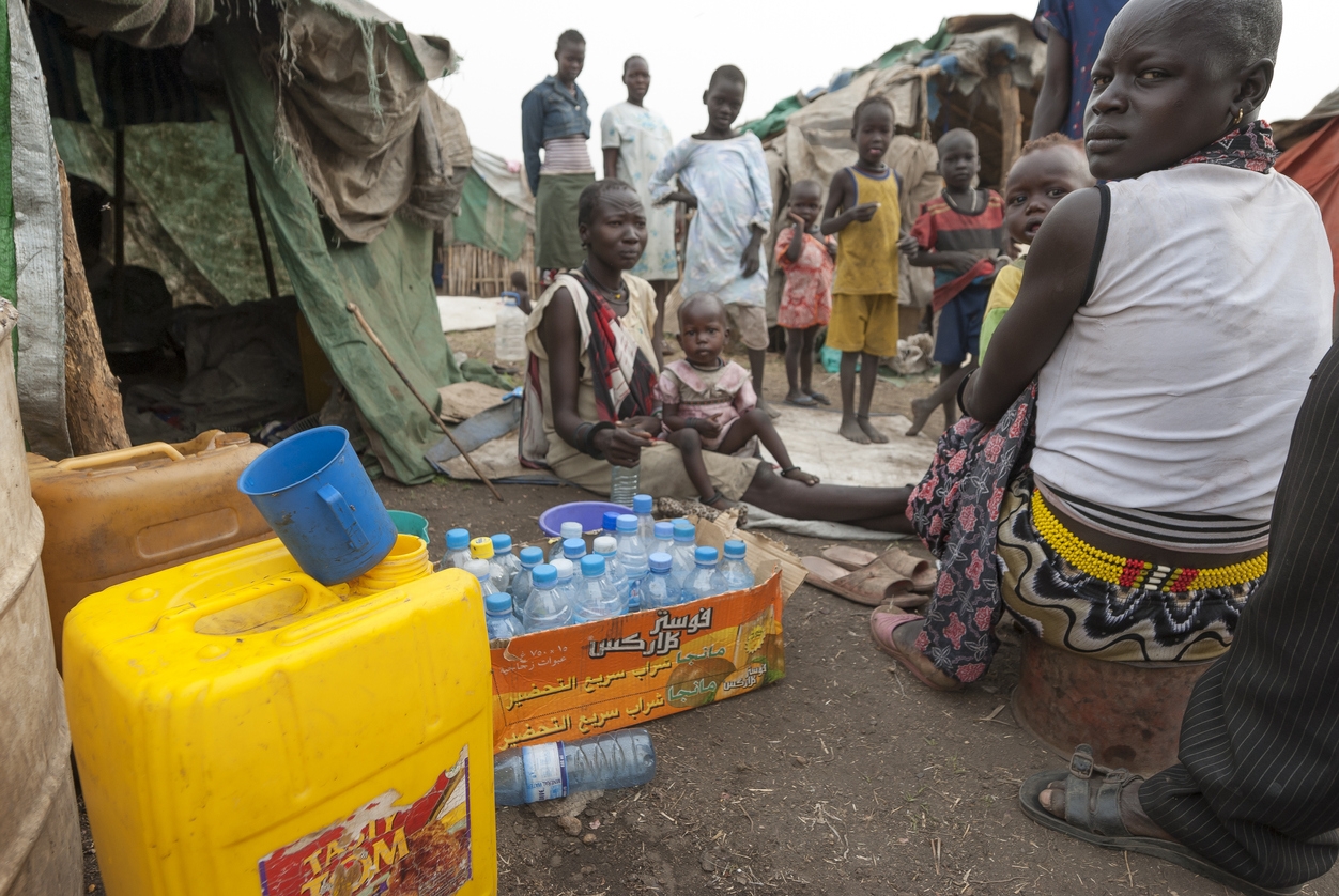 People prepare collect water in refugee camp, Juba, South Sudan