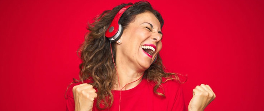 Woman-listening-music-through-a-headphone-