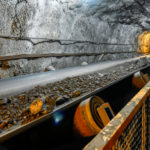 Belt conveyor in an underground tunnel for the transportation of ore to the surface