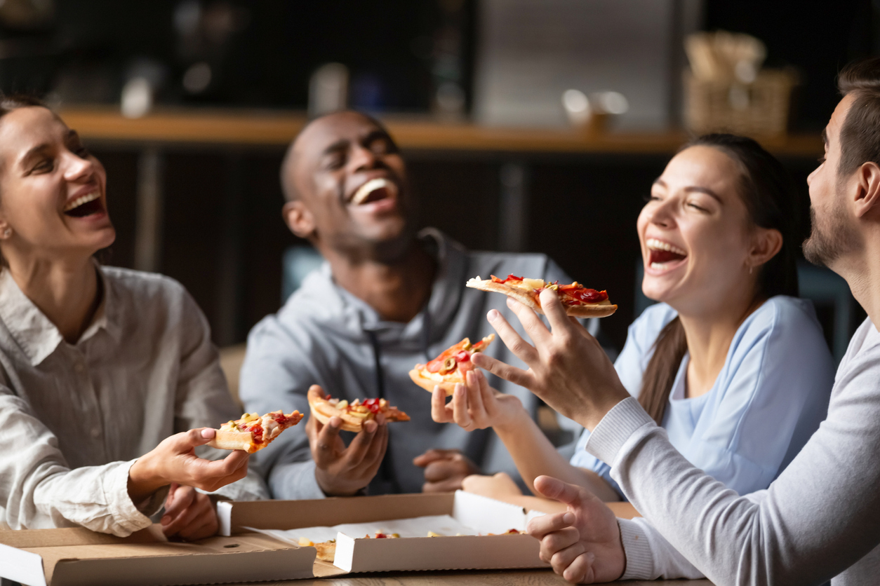 friends eating pizza together