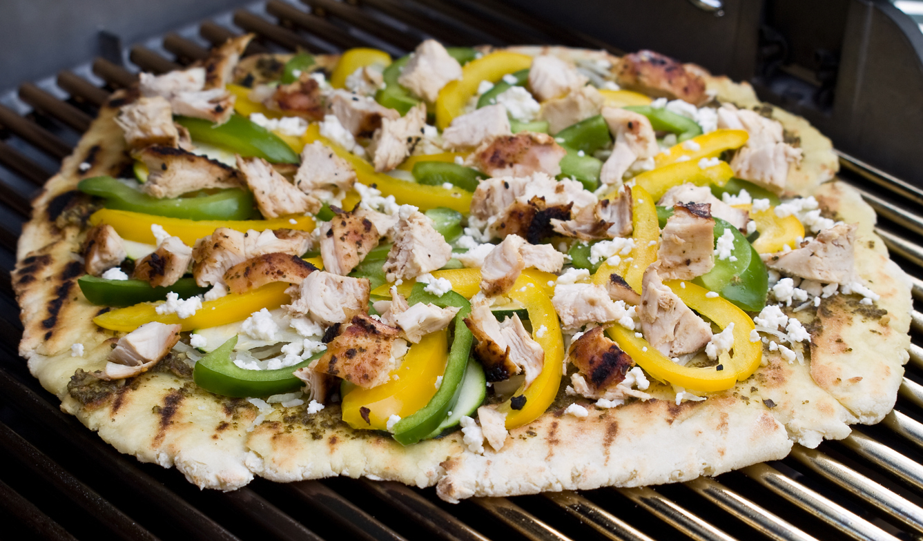 grilled pizza topped with peppers and barbecue