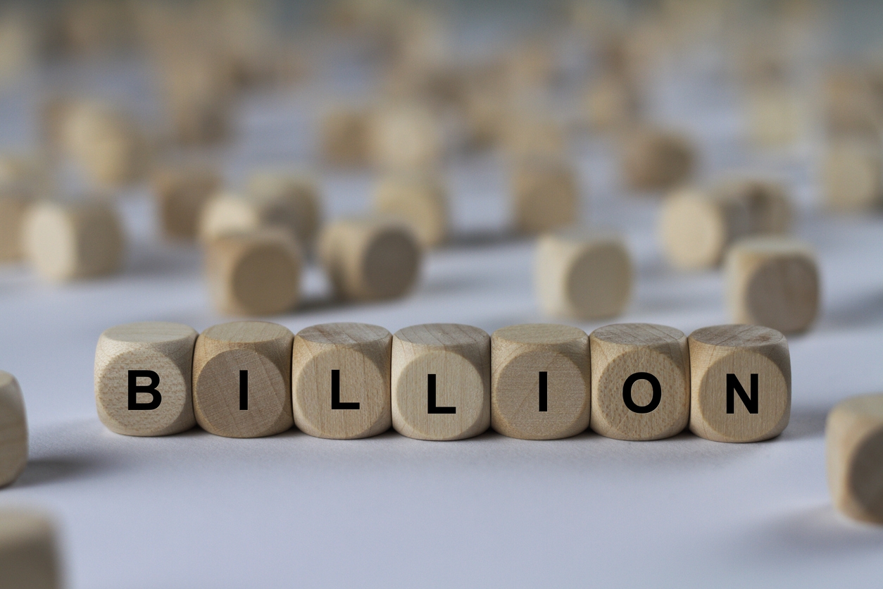 the word “billion” spelled using wooden cubes with letters