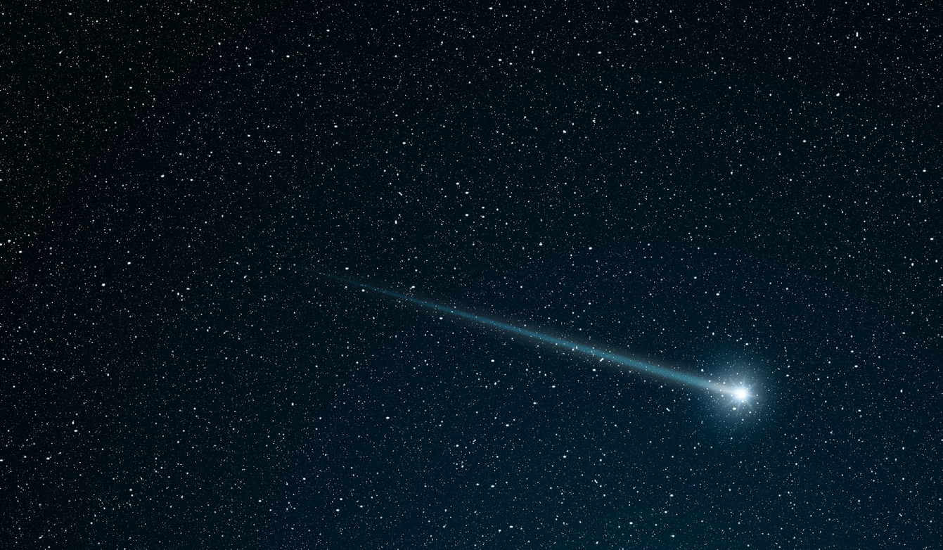 a shooting star across the star field