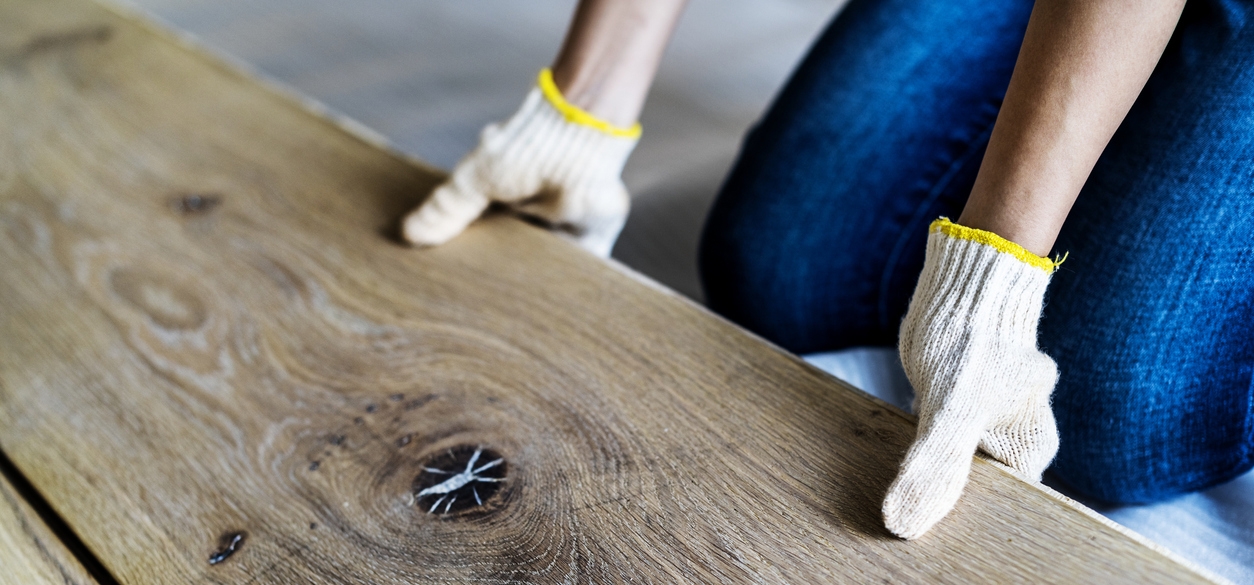person holding a hardwood flooring