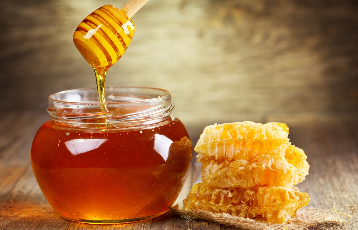 a jar of honey and honeycomb