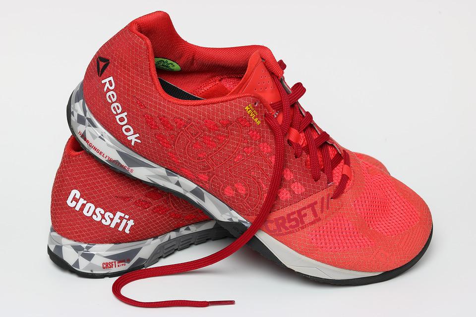 a pair of red Reebok crossfit shoes