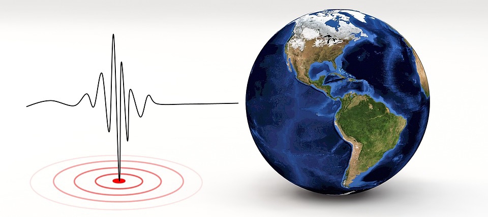 earthquake seismograph beside the Earth