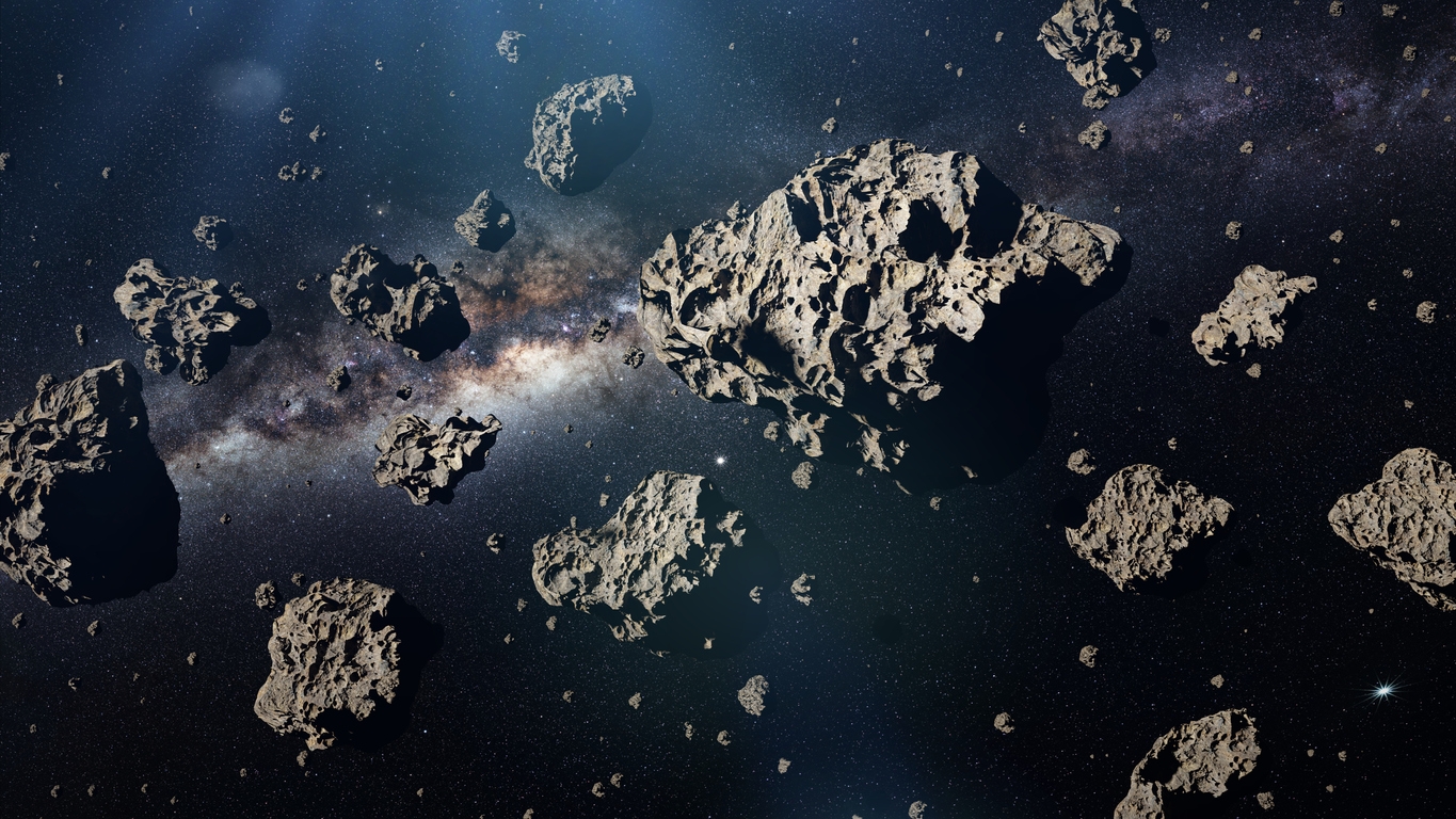 group of asteroids in front of the Milky Way galaxy
