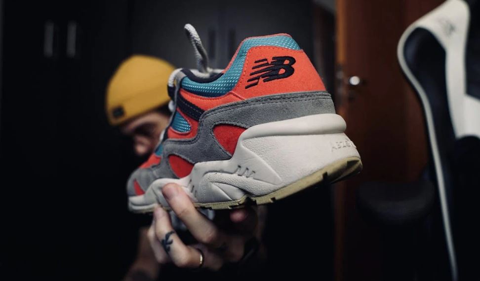 person holding a New Balance shoe
