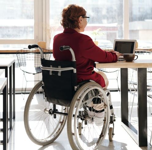 a woman sitting on a wheelchair