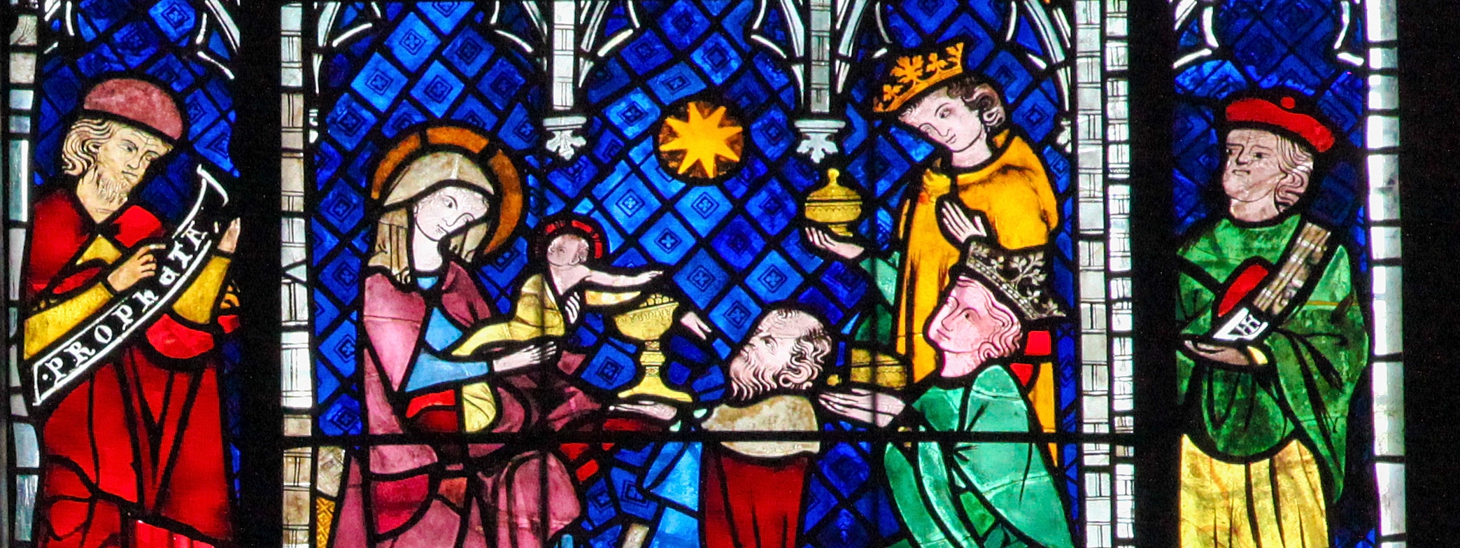 a stained glass art of the Adoration of the Magi in the cathedral of Strasbourg, France