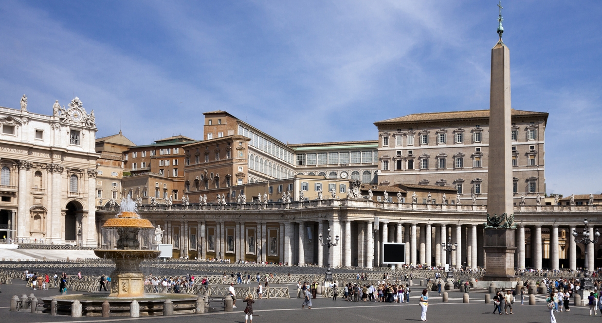 panorama view of St Peter's square along with St Peter's basilica colonnade and obelisk