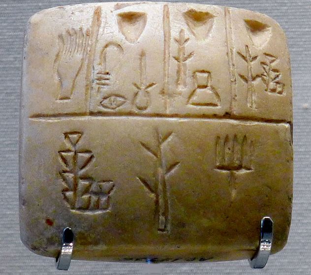 Tablet with pictographic pre-cuneiform writing; late 4th millennium BC; limestone; height: 4.5 cm, width: 4.3 cm, depth: 2.4 cm; Louvre