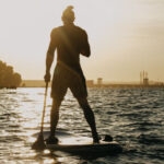 man standing on a paddleboard