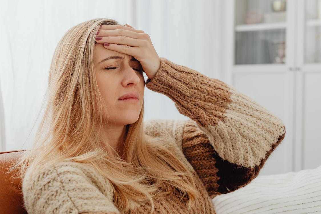 woman suffering from intense headache