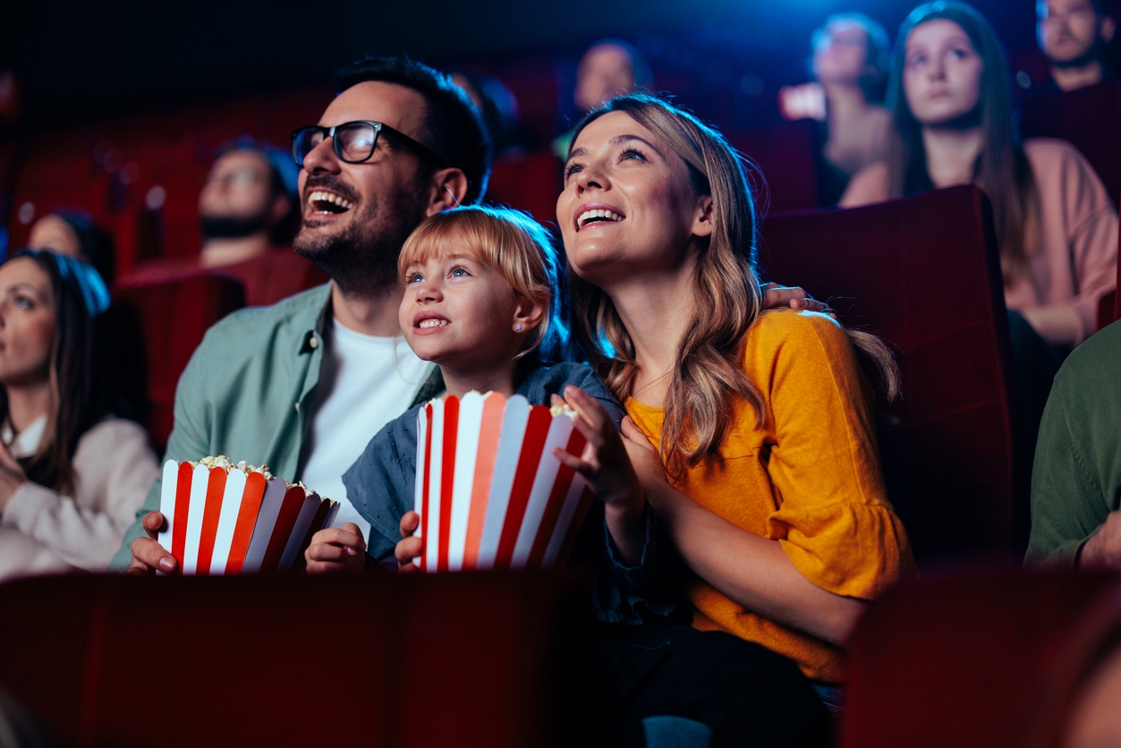 People enjoying popcorn in theater