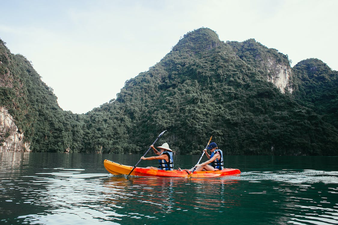 People kayaking in serene sea