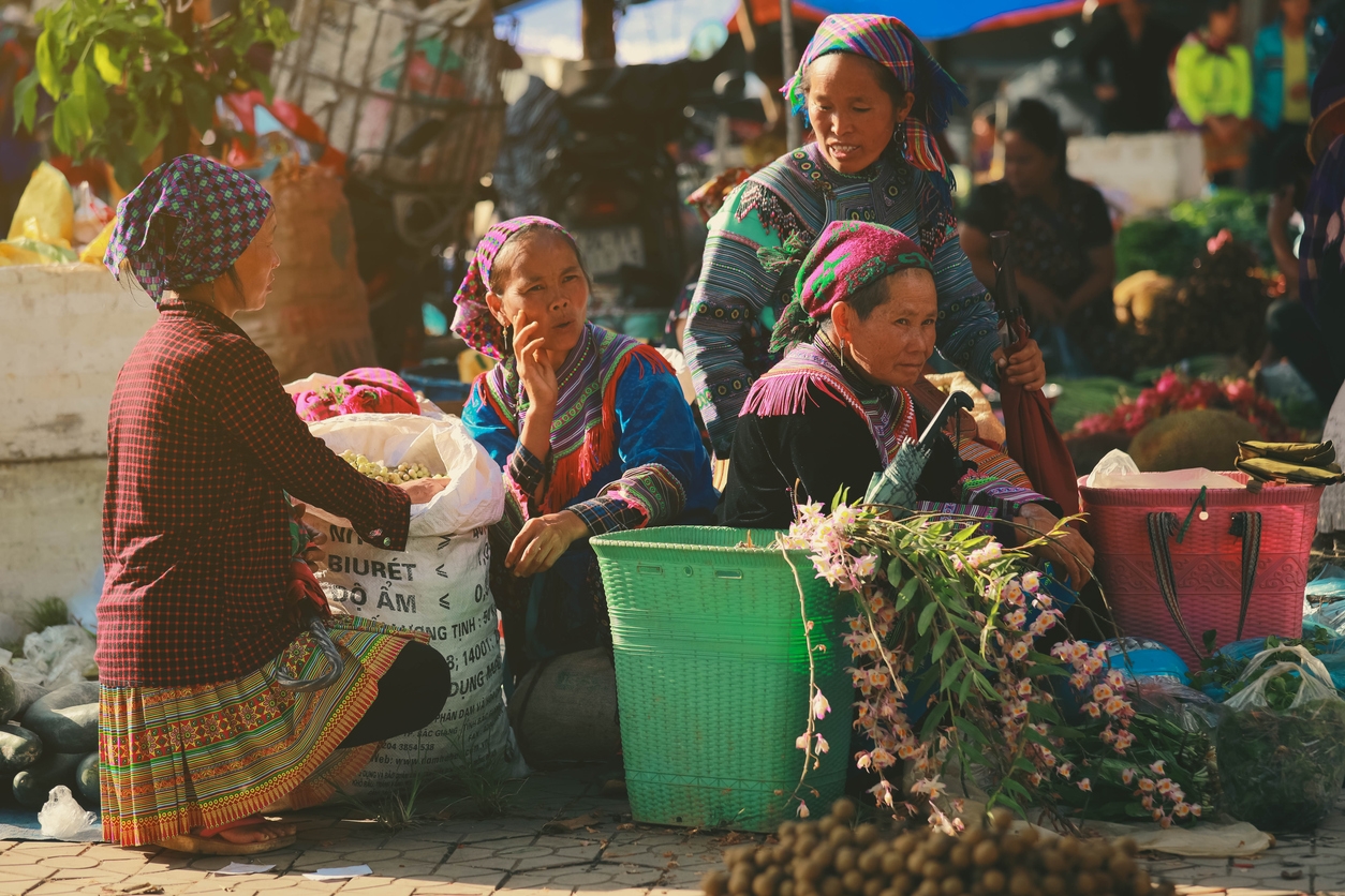 The Miao tribe women selling vegetables in the open market