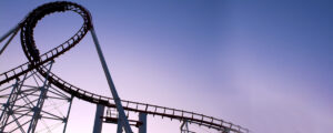Roller coaster track against dusky sky