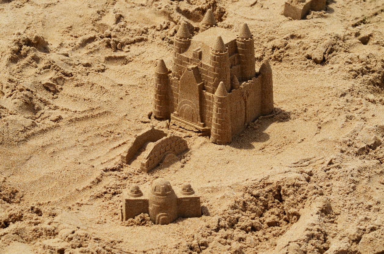 Simple sandcastle with a flag