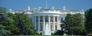 the White House pictured against blue sky